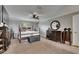 Spacious main bedroom with beautiful furniture, crown molding, and a cozy, inviting atmosphere at 5057 Ivory Stone Dr, Wimauma, FL 33598