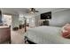 Comfortable main bedroom with connecting rooms, stylish furniture and a ceiling fan at 5057 Ivory Stone Dr, Wimauma, FL 33598