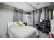 Cozy bedroom with casual decor, desk space, and comfortable seating area at 5149 4Th St, Zephyrhills, FL 33542