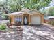 Charming single-Gathering home featuring a cozy front porch and well-manicured landscaping at 5149 4Th St, Zephyrhills, FL 33542