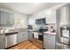 Updated kitchen featuring stainless steel appliances, modern countertops, and ample cabinetry at 5149 4Th St, Zephyrhills, FL 33542