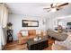 Inviting living room featuring a cozy leather sofa, modern decor and hardwood floors at 5149 4Th St, Zephyrhills, FL 33542