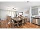 Open-concept living space with modern decor, hardwood floors, and an adjacent dining area at 5149 4Th St, Zephyrhills, FL 33542