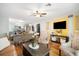 Open-concept living space with modern decor, hardwood floors, and a cozy seating area at 5149 4Th St, Zephyrhills, FL 33542