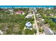Gorgeous aerial view featuring surrounding neighborhood and beach nearby this lovely home at 540 Gulf Bay Rd, Longboat Key, FL 34228
