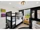 A cozy bedroom featuring bunk beds, a bedside table, and nautical-themed decor for a fun space at 540 Gulf Bay Rd, Longboat Key, FL 34228
