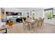 Open-concept dining room and kitchen, with room to entertain large groups at 540 Gulf Bay Rd, Longboat Key, FL 34228