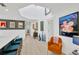 Bright hallway with skylight and modern decor, connecting the kitchen to other living spaces at 540 Gulf Bay Rd, Longboat Key, FL 34228