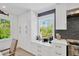 Kitchen nook with stylish counters and window views at 540 Gulf Bay Rd, Longboat Key, FL 34228