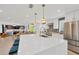 Spacious kitchen with an island, open layout to dining and living spaces, and stainless steel appliances at 540 Gulf Bay Rd, Longboat Key, FL 34228