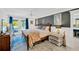 Inviting main bedroom with ensuite bath and balcony access, perfect for relaxation and enjoyment at 540 Gulf Bay Rd, Longboat Key, FL 34228