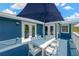 Outdoor dining area on the patio with seating for six, perfect for entertaining at 540 Gulf Bay Rd, Longboat Key, FL 34228