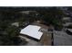 An aerial view of a fenced in yard and surrounding greenery at 5417 Golden Dr, Tampa, FL 33634