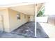 Covered back patio with a concrete floor overlooks a spacious backyard with a privacy fence, providing relaxation and entertainment at 5417 Golden Dr, Tampa, FL 33634