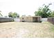 Spacious backyard features a well-maintained lawn and privacy fence, creating a secure and inviting outdoor space at 5417 Golden Dr, Tampa, FL 33634