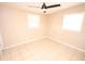 Bedroom with a ceiling fan and tile flooring at 5417 Golden Dr, Tampa, FL 33634