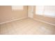 Clean bedroom features tiled floor, natural light and a serene atmosphere at 5417 Golden Dr, Tampa, FL 33634