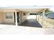 Attached carport providing covered parking and a front entry into the residence at 5417 Golden Dr, Tampa, FL 33634