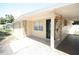 Tiled entrance with natural stone decor, leading to an inviting front door with carport access at 5417 Golden Dr, Tampa, FL 33634