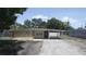 Charming single-story home with stone accents and a covered carport provides curb appeal and practicality at 5417 Golden Dr, Tampa, FL 33634