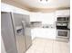Modern kitchen with stainless steel appliances and white cabinets at 5417 Golden Dr, Tampa, FL 33634