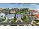 Upscale waterfront homes in a coastal community with mature palm trees and manicured lawns with water access at 6024 Kipps Colony E Dr, Gulfport, FL 33707