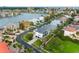 Beautiful waterfront community with luxurious homes, lush green landscaping, and close proximity to water activities at 6024 Kipps Colony E Dr, Gulfport, FL 33707