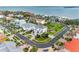Upscale waterfront homes in a coastal community with mature palm trees and manicured lawns with water access at 6024 Kipps Colony E Dr, Gulfport, FL 33707