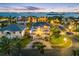 Breathtaking aerial view of a luxury waterfront home with lush landscaping and amazing city views at 6024 Kipps Colony E Dr, Gulfport, FL 33707