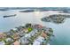 Breathtaking aerial view of waterfront homes, lush landscaping, and stunning coastline perfect for upscale living at 6024 Kipps Colony E Dr, Gulfport, FL 33707