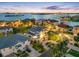 Stunning aerial view of a luxury waterfront neighborhood with a gorgeous home and lush landscaping at twilight at 6024 Kipps Colony E Dr, Gulfport, FL 33707