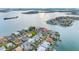 Breathtaking aerial view of waterfront homes, lush landscaping, and stunning coastline perfect for upscale living at 6024 Kipps Colony E Dr, Gulfport, FL 33707