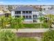 Exterior shot of a home's backyard and fence with palm trees at 6024 Kipps Colony E Dr, Gulfport, FL 33707