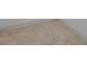 Close up of light brown tile flooring and baseboard trim at 6024 Kipps Colony E Dr, Gulfport, FL 33707