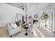 Bright living room with high ceilings, neutral tones, a fireplace, and large windows creating an open space at 6024 Kipps Colony E Dr, Gulfport, FL 33707