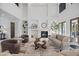 Stylish living room featuring a fireplace, modern décor, and abundant natural light at 6024 Kipps Colony E Dr, Gulfport, FL 33707