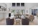Spacious living room with soaring ceilings, a fireplace, and neutral furnishings creating an airy atmosphere at 6024 Kipps Colony E Dr, Gulfport, FL 33707