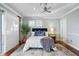 Comfortable main bedroom featuring a ceiling fan and a cozy decor at 6024 Kipps Colony E Dr, Gulfport, FL 33707
