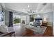 Spacious main bedroom with hardwood floors and a sliding glass door to the patio at 6024 Kipps Colony E Dr, Gulfport, FL 33707