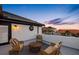 Charming rooftop patio with comfortable wicker furniture and stunning neighborhood views at sunset at 6024 Kipps Colony E Dr, Gulfport, FL 33707