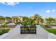 Neighborhood street view showcasing stunning homes, lush landscaping, and a serene residential setting at 6024 Kipps Colony E Dr, Gulfport, FL 33707