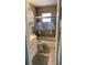 Cozy bathroom featuring a shower with decorative palm tree glass doors at 6405 Klaus Ct, Port Charlotte, FL 33981