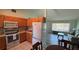 Well-lit kitchen with appliances seamlessly connects to a comfortable living area creating an inviting space at 6405 Klaus Ct, Port Charlotte, FL 33981