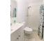 Cozy bathroom with tiled shower featuring a seashell themed shower curtain at 6423 Boxwood St, Brooksville, FL 34602