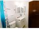 This functional bathroom features a vanity with storage, a mirror, and a shower with modern fixtures at 6423 Boxwood St, Brooksville, FL 34602