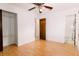 Bright bedroom with wood floors, closet, and view of the en-suite bathroom at 6423 Boxwood St, Brooksville, FL 34602
