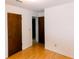 This bedroom features laminate floors, a large closet, and a neutral paint color, ideal for relaxation at 6423 Boxwood St, Brooksville, FL 34602