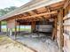 Covered garage with a brick paved driveway offers sheltered parking and potential storage space at 6423 Boxwood St, Brooksville, FL 34602