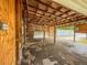 Unfinished garage with exposed wood beams and unfinished concrete flooring awaiting customization and upgrades at 6423 Boxwood St, Brooksville, FL 34602