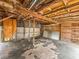 Inside the garage, a clear space with exposed beams offers customization for storage or hobbies at 6423 Boxwood St, Brooksville, FL 34602